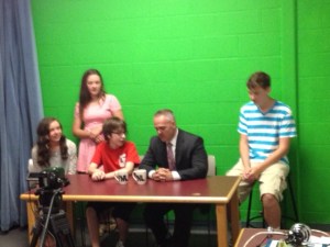 Secretary Malone taping a news segment with Parker students which will be shown on Channel 5