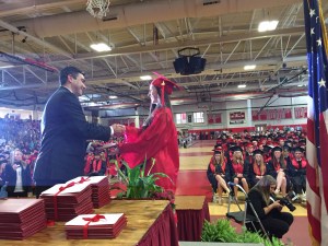 Julia Popken receives her diploma from former School Committee Chair, Chris Caruso